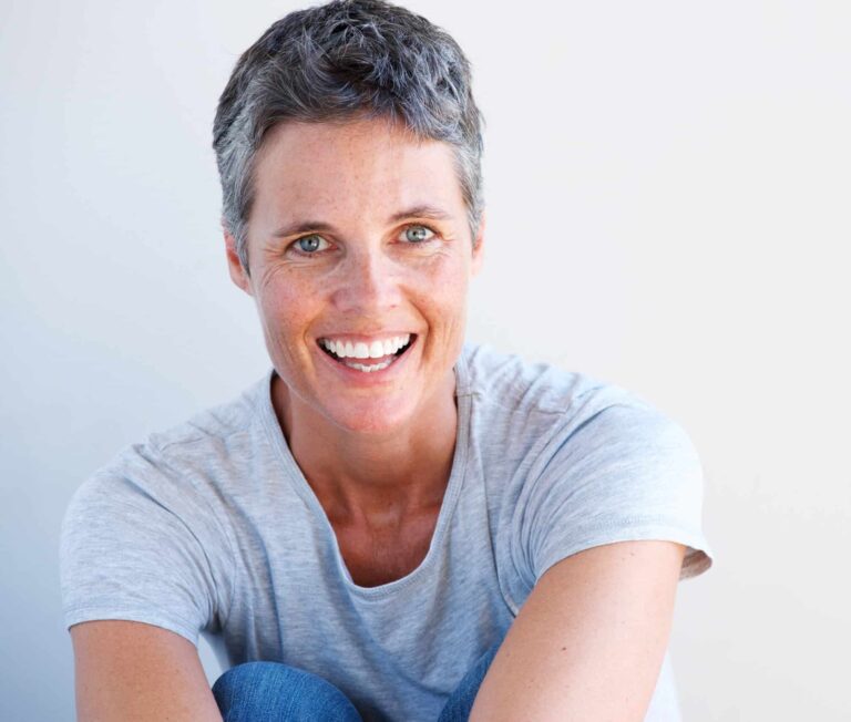 Close-up of older person smiling with healthy teeth